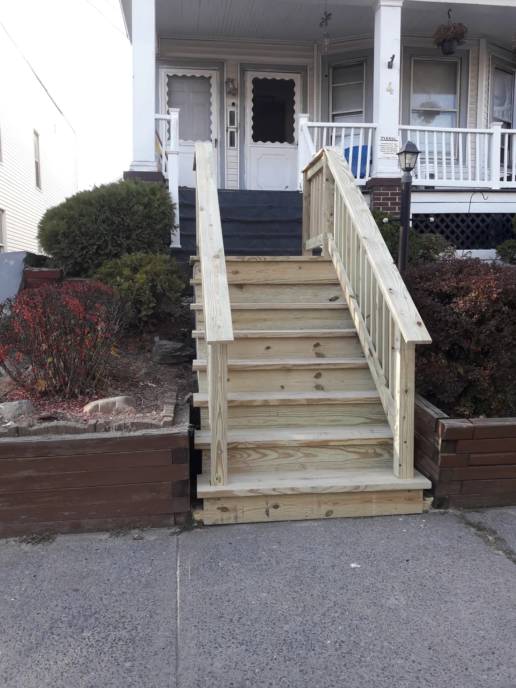 Custom wood entry staircase to front porch