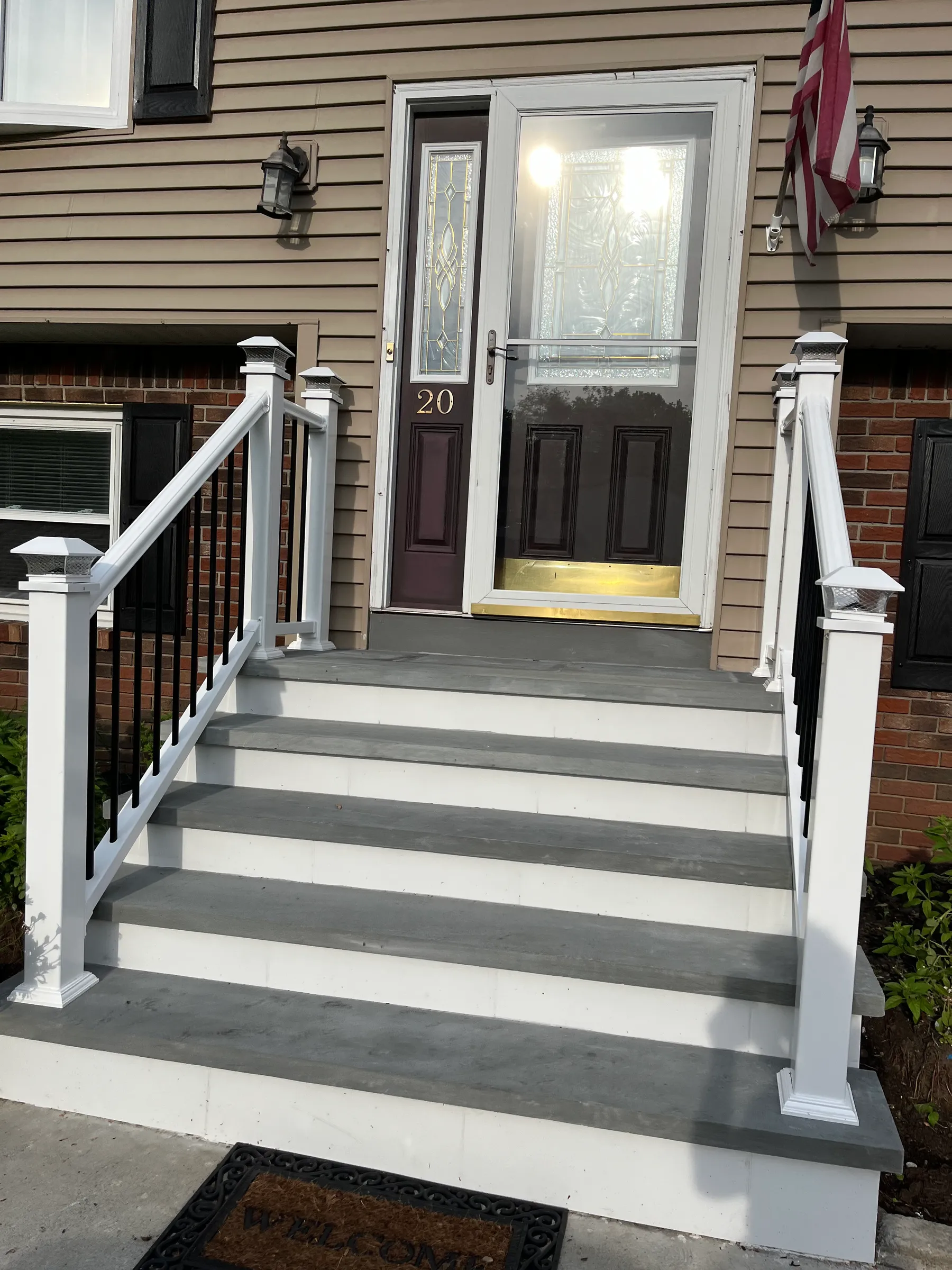 White porch stair detail with columns
