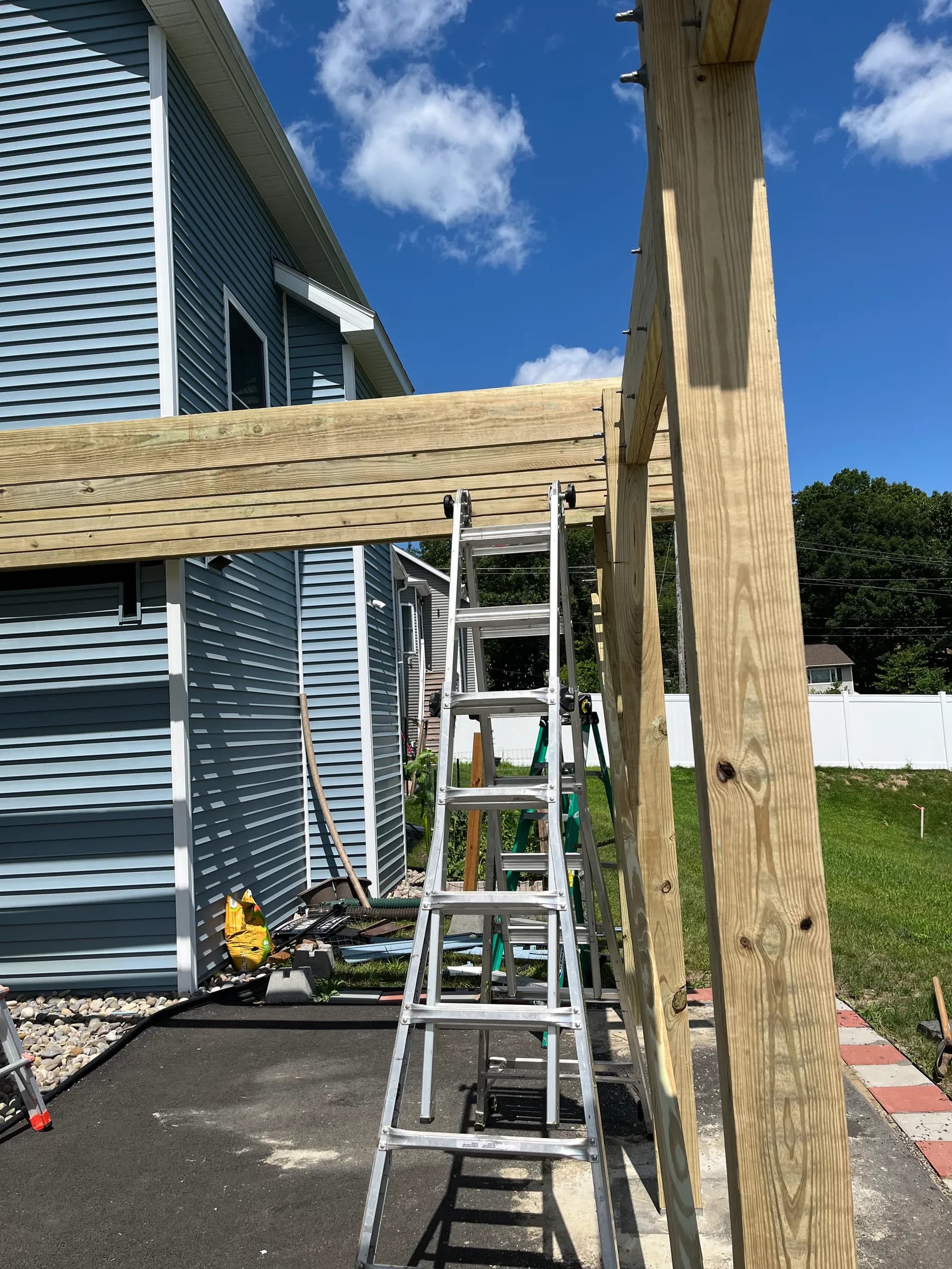 Pergola post construction on metal roof structure