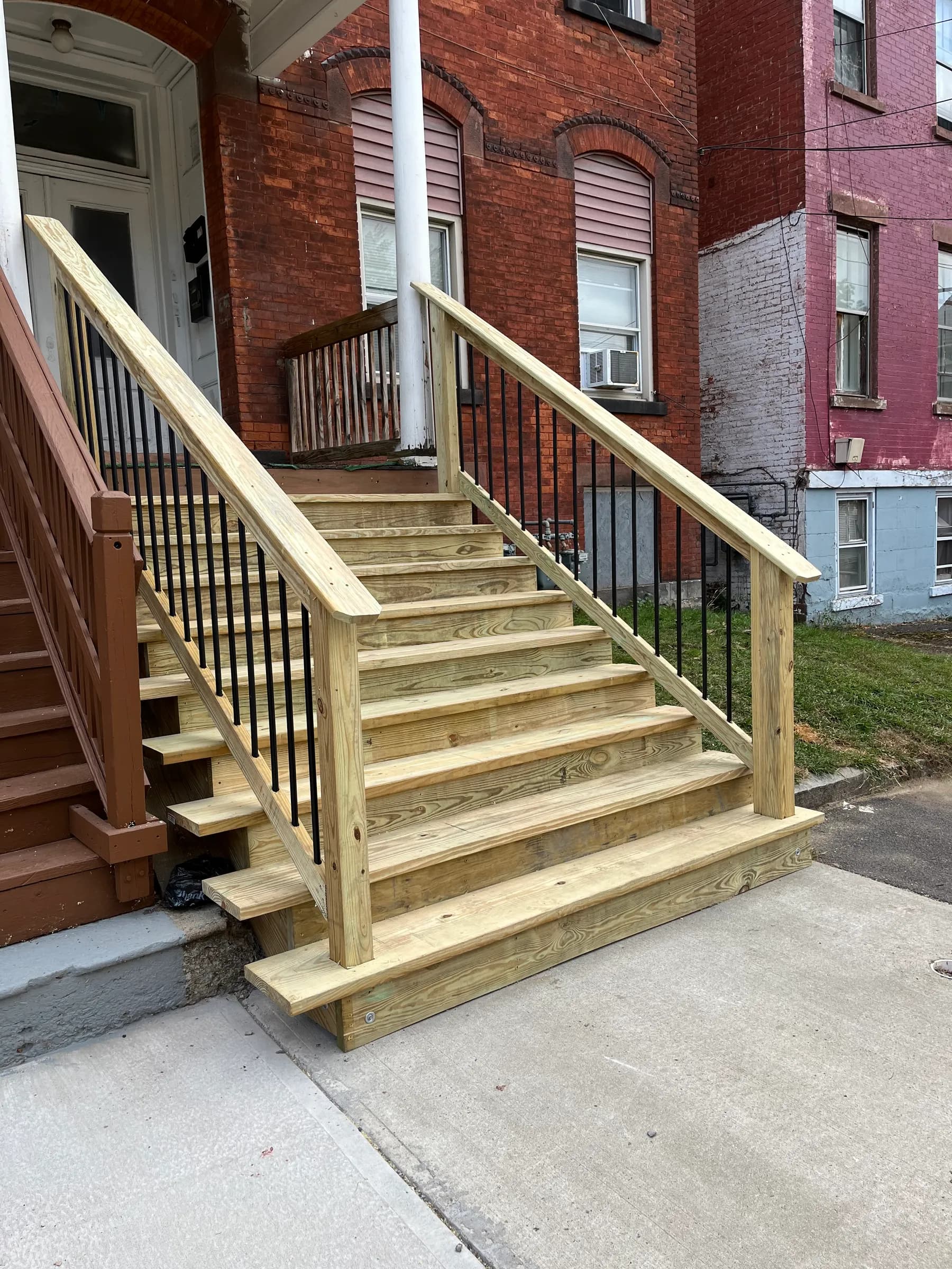 Front stairs in new wood at row house