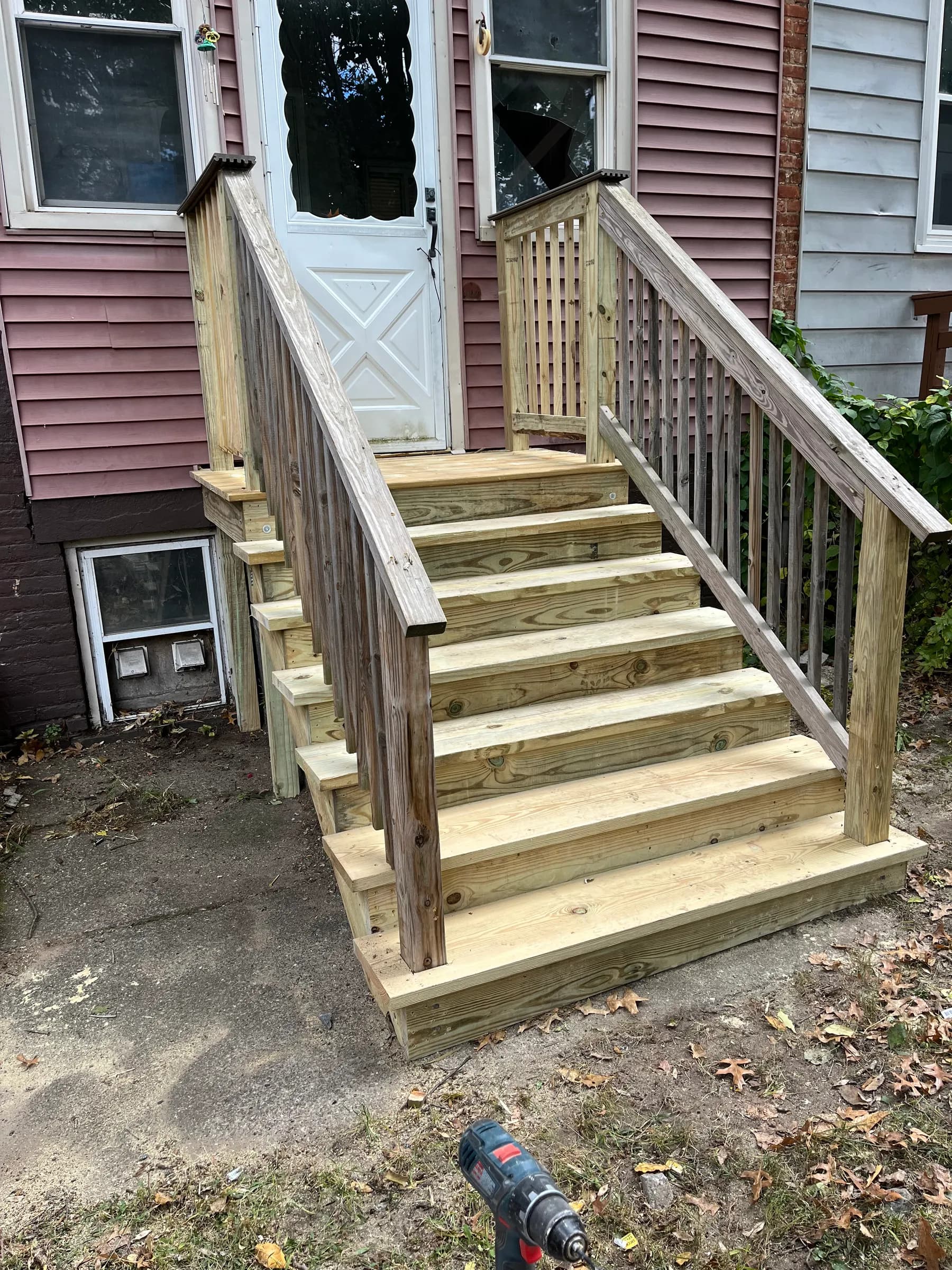 New wood porch stairs and railing entrance