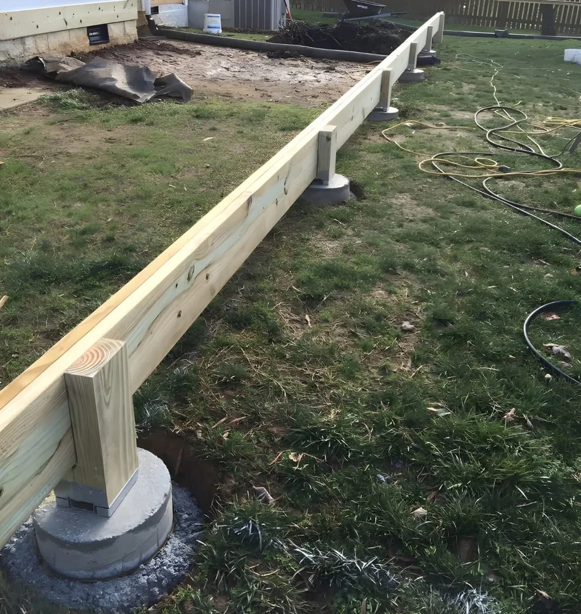 Deck ledger board on concrete piers foundation