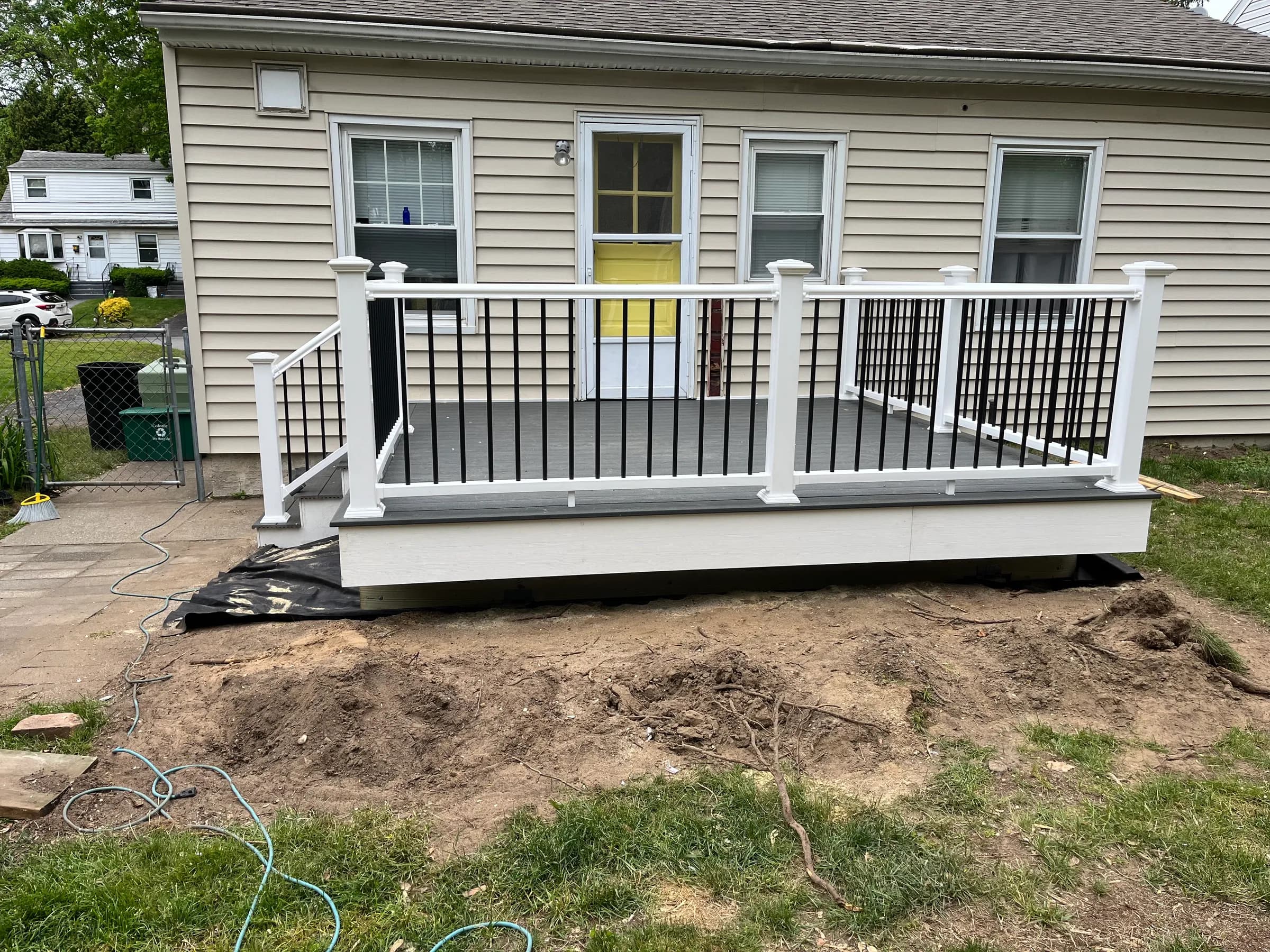 Front view of gray deck and home exterior
