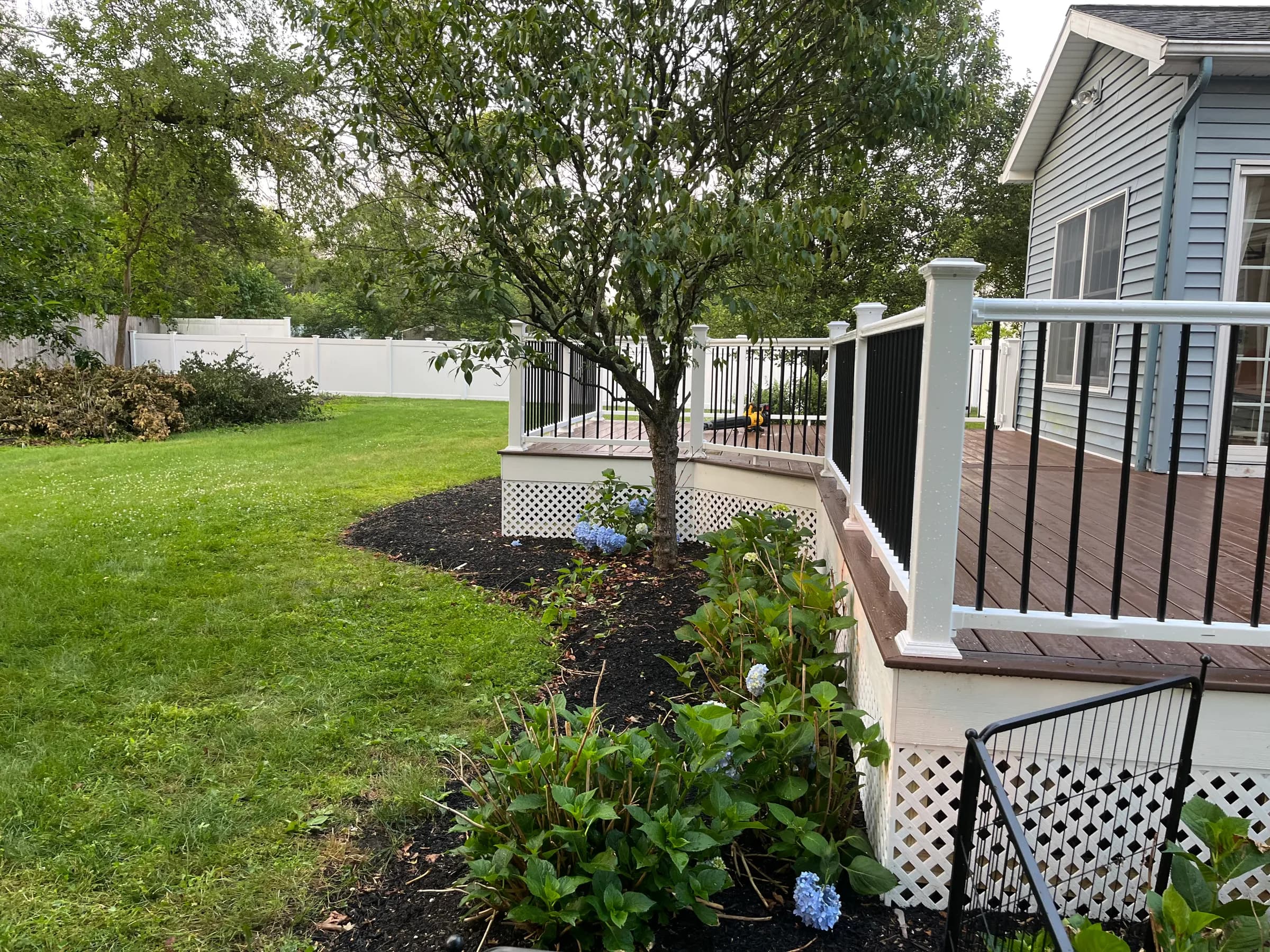 Deck with surrounding mulch landscape bed