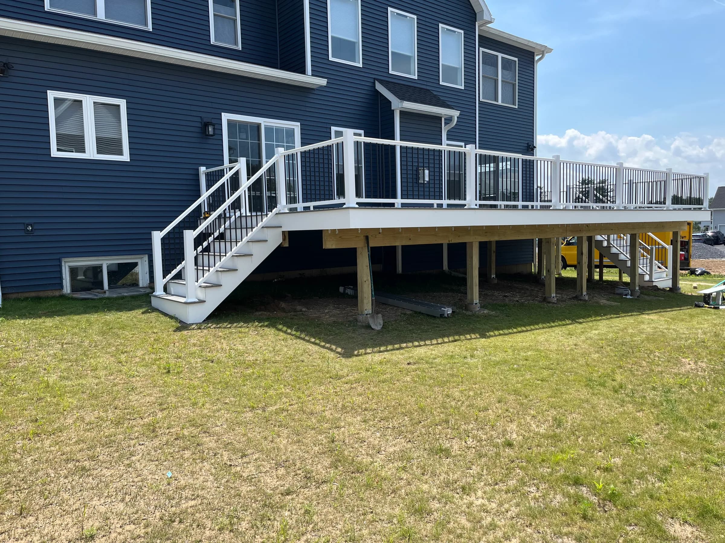 White elevated deck with aluminum railings