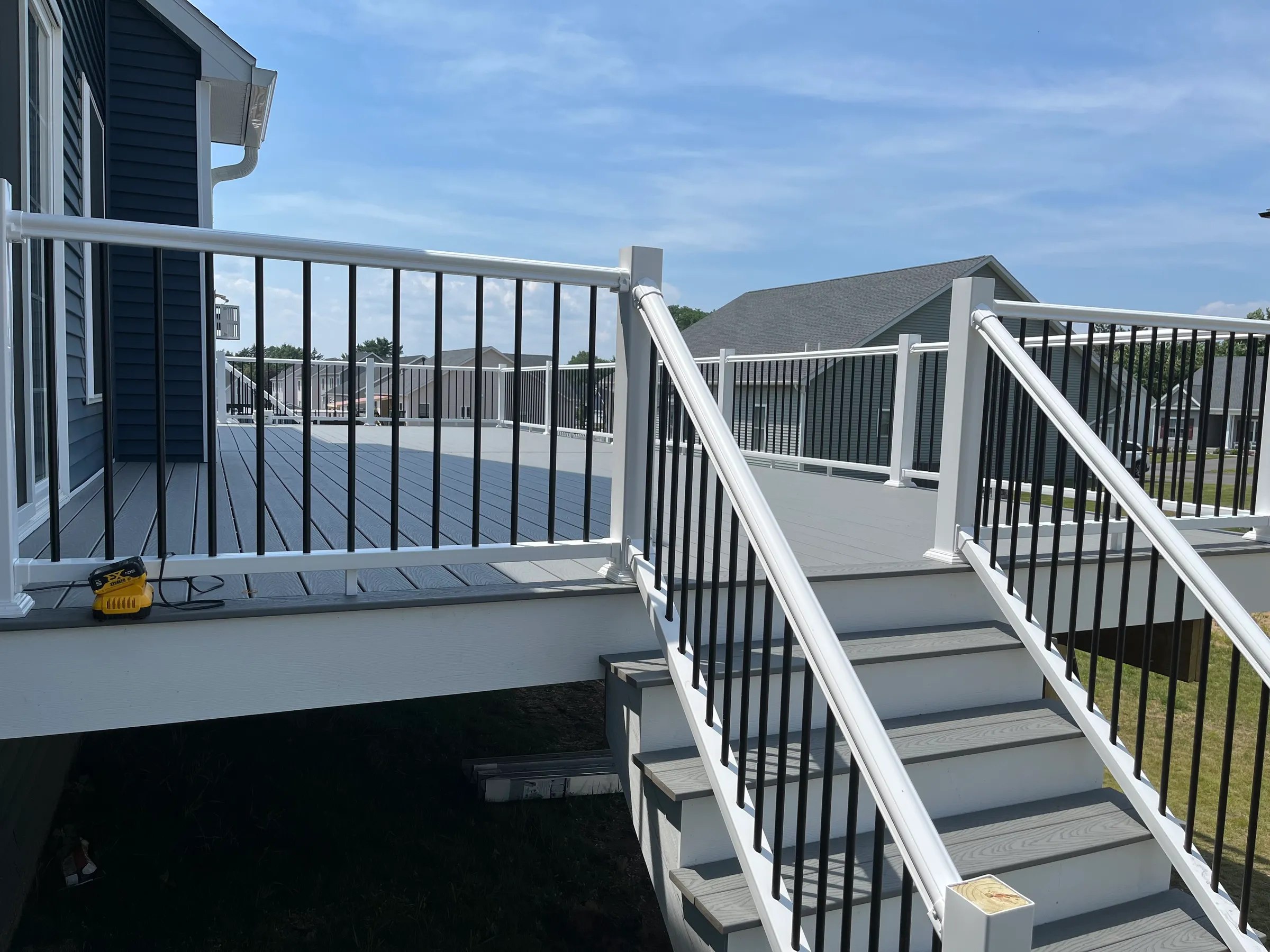 Partial white deck with visible stair construction