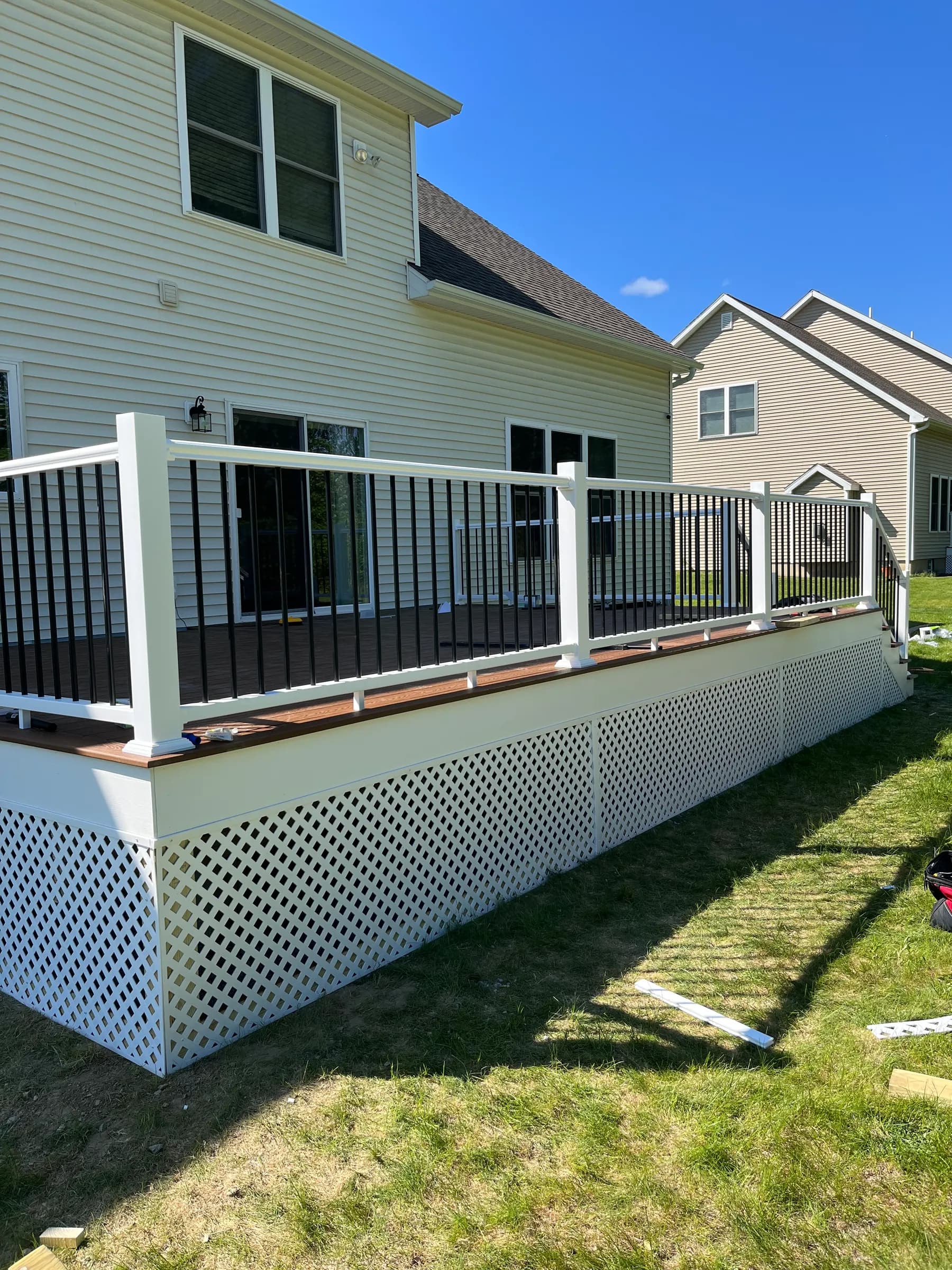Elevated deck with pergola and lattice skirt