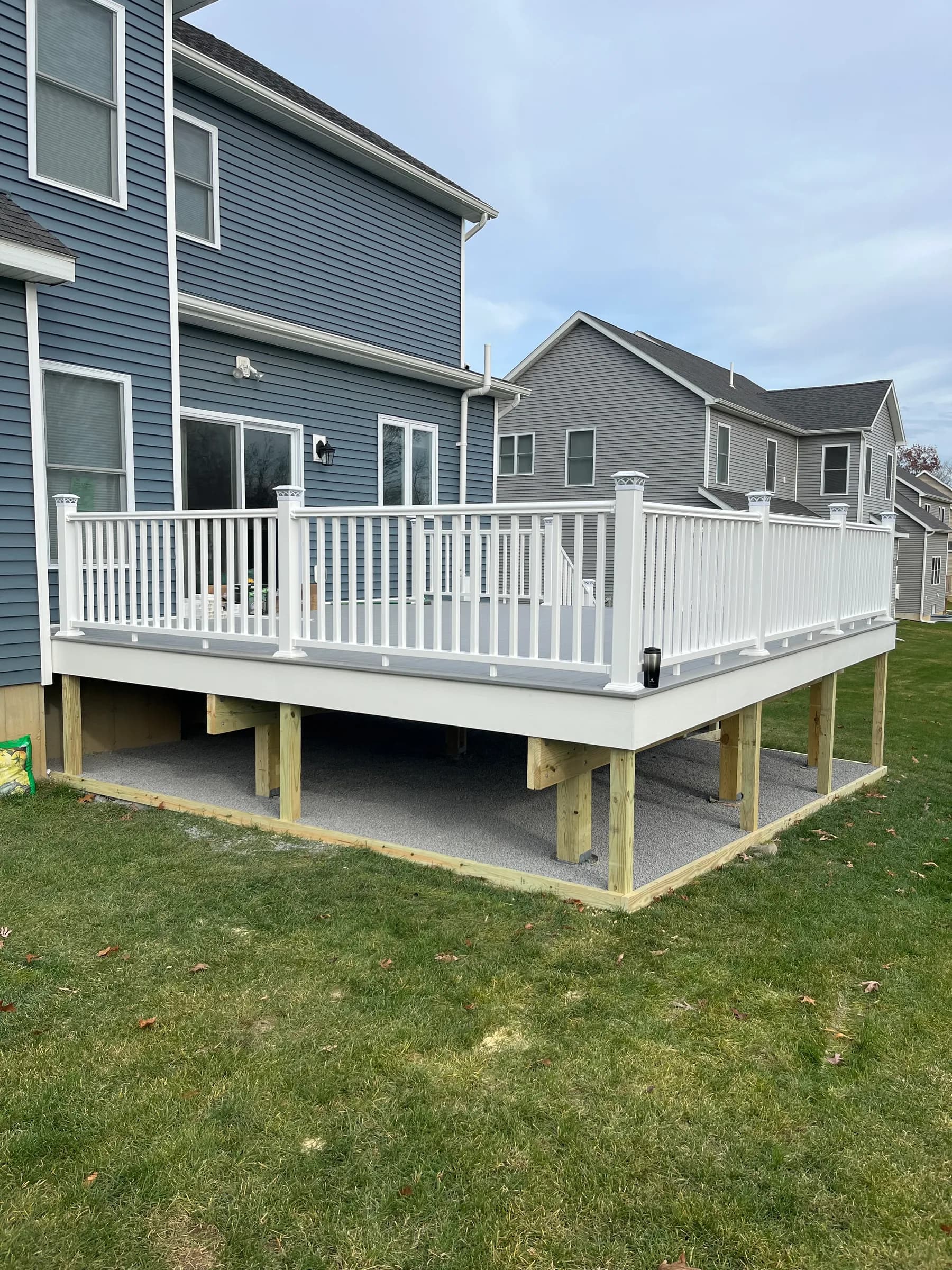 White deck with stair tower on dark house